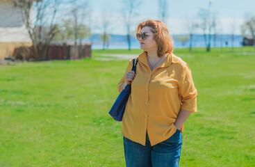 Pretty American middle age woman in vacation or at city. Size plus and xxl woman. Life of plump...