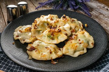 Fried dumplings (pierogi) with spinach.