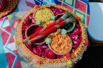 Traditional puja thali - plate for the ritual ceremony with kumkum, haldi or turmeric powder,...