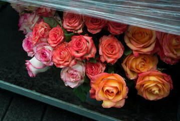 Closeup of orange roses bouquets at the florist in the street