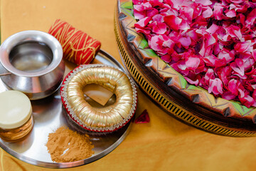 Traditional puja thali - plate for the ritual ceremony with kumkum, haldi or turmeric powder,...