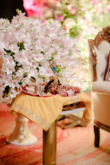 Traditional puja thali - plate for the ritual ceremony with kumkum, haldi or turmeric powder, flowers and diya (oil lamp). Hindu sacral element for worshipping God.