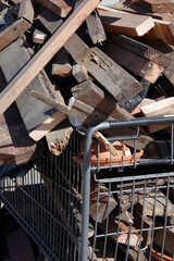 Remnant construction wood collected in a shopping cart