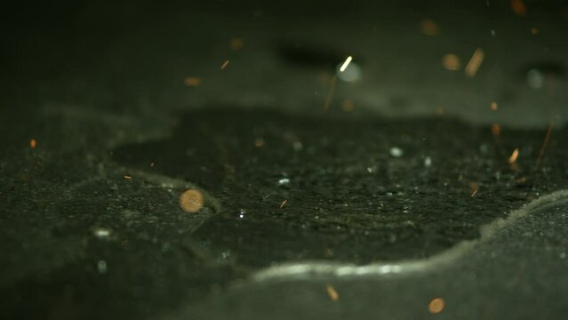  sparks in ultra slow motion 1-500 fps on a reflective
