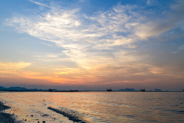 beautiful sky on sunrise with fishing boat at Koh mook.Trang, Thailand.
