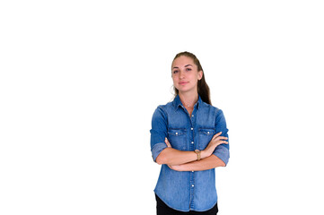 Portrait of beautiful woman in blue jeans shirt, crossed arms posing and standing on white background with copy space. Looking at camera.