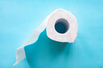 toilet paper roll on blue background. Quarantine 2020 concept