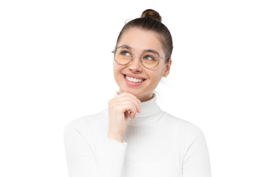 Young woman in glasses looking up, thinking of pleasant future plans, dreaming