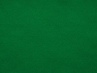 Enveloping forest green felt, rich in texture, creates a haven of stillness, inviting introspection and creative musings