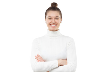 Young girl with hair tied in bun and arms crossed, wearing white sweater, looking at viewer with...