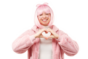 Young woman showing heart gesture with hands, sharing love