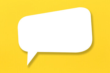 Empty white paper in speech bubble shape set against yellow background. - 790910343