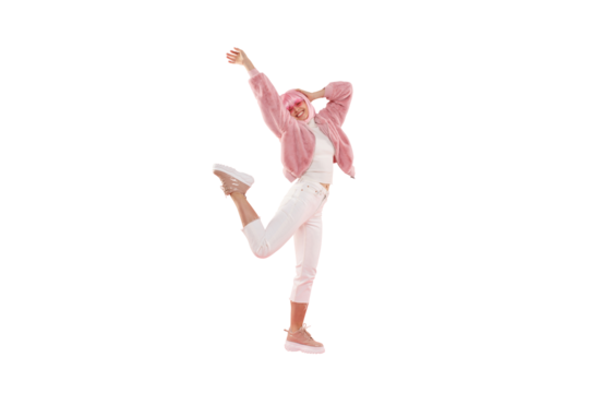 Full length portrait of young happy girl wearing funky clothes and colored wig, dancing and jumping at party