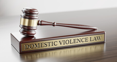 Domestic violence law: Judge's Gavel as a symbol of legal system and wooden stand with text word