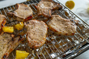 Oven grilled marinated pork chops on an oven rack