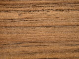 A textured light brown wooden surface showcasing natural patterns and grains