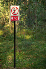 Palanga / Lithuania - September 15 2023: funny symbol or sign tell about don't urine or don't urinate in the forest park "HBH"