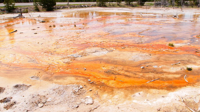 An orange geothermal natural hot springs in Wyoming