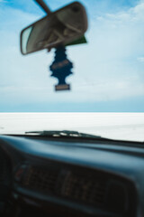 Point of view from old off-road car of Salar de Uyuni salt flats in Bolivia