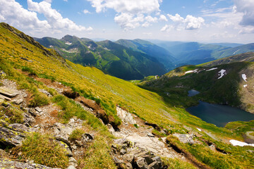 capra lake of fagaras range on a sunny day. summer nature scenery in mountains of romania. popular travel destination of transylvania alps