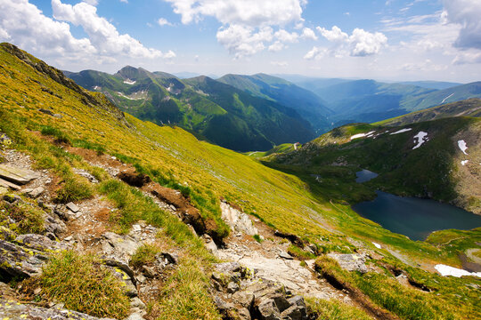capra lake of fagaras range on a sunny day. summer nature scenery in mountains of romania. popular travel destination of transylvania alps