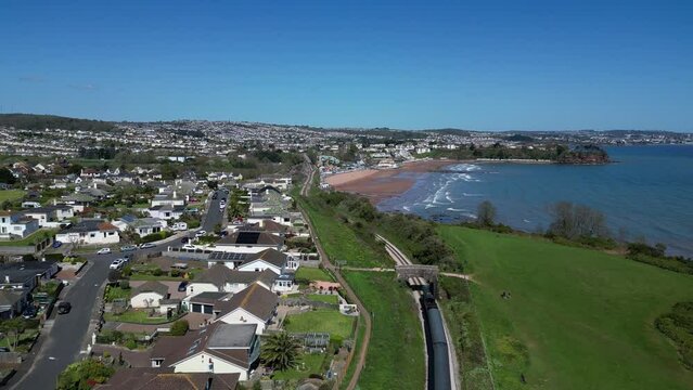Waterside, Torbay, South Devon, England: DRONE VIEWS: A steam train on route to Paignton on the Torbay Steam Railway line. The steam trains are a major tourist attraction for UK holidaymakers (Clip 1)