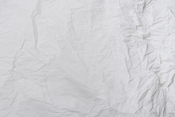 Crumpled white paper background.