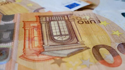 50 euro banknotes rotating on rotating table in 360 degrees in macro shot	