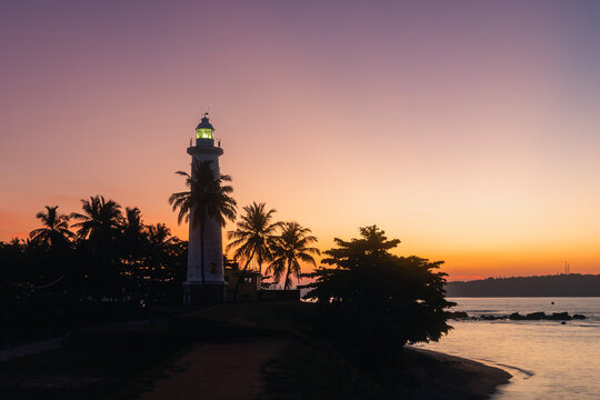 Silhouette of lighthouse in Galle fort at beautiful dawn. South coast of Sri Lanka..