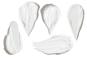 white smears of cream on empty background