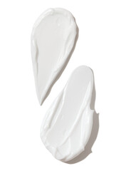 white smears of cream on empty background