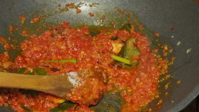 the process of cooking spicy spices or chili sauce, a homemade recipe for marinating chicken, fish, shrimp, or other proteins