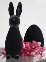 modern black velvet easter bunny decorated with pink flowers