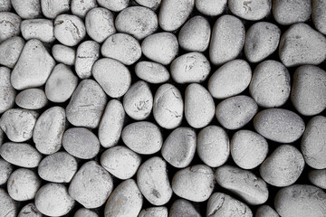 Pile of stones in black dirt texture