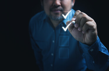 Businessman touching on the mark in the checkbox for quality document control checklist and...