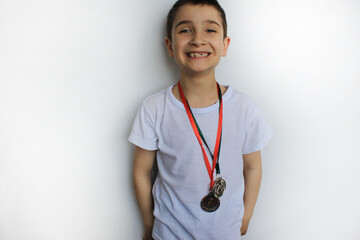 happy boy won medals