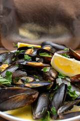 Mussels in wine sauce with lemon and herbs