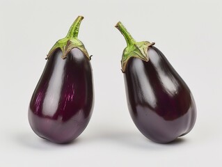 Set of ripe aubergines, sleek purple and glossy