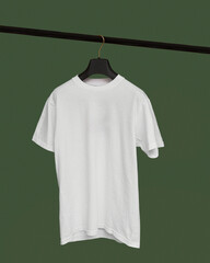 A white T-shirt hangs on a black hanger on a green background. Makap T-shirts