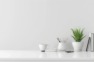 Minimalist white desk with potted plant, coffee cup, and neatly arranged office supplies