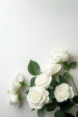 A bouquet of white roses displayed on a plain white surface.