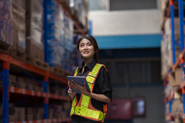 Warehouse worker working in warehouse storage. Foreman or worker work at factory site check up...