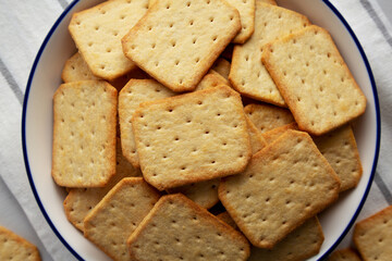 Oven Baked Crackers on a Plate, top view. Flat lay, overhead, from above.