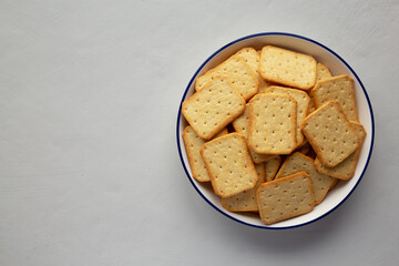 Oven Baked Crackers on a Plate, top view. Flat lay, overhead, from above. Copy space.