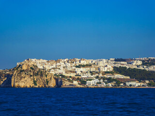 Scenic view of the city of Peschici along the coast of Puglia, Foggia, Italy, Europe. Vacation in Gargano National Park in the Mediterranean Adriatic Sea. Paradise destination in summer