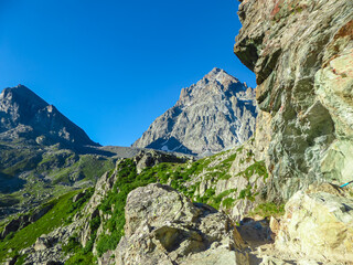 Panoramic view from mountain summit Monte Viso (Monviso) in the Cottian Alps, Cuneo, Piemonte, Italy, Europe. Massive rock walls and ridges of the Stone king. Majestic landscape. Wanderlust, climbing