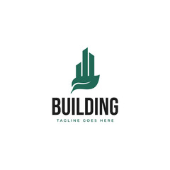 Fototapeta premium Green city building with leaf logo design illustration idea
