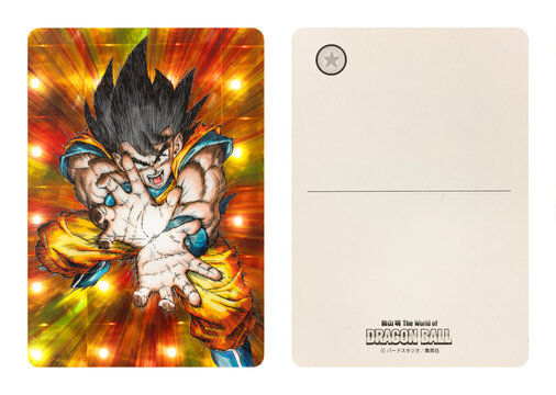 tokyo, japan - mar 27 2013: Glossy holographic postcard available at the "Akira Toriyama The World of DRAGONBALL" exhibition depicting the hero Son Goku performing a kamehameha attack. (left: front)