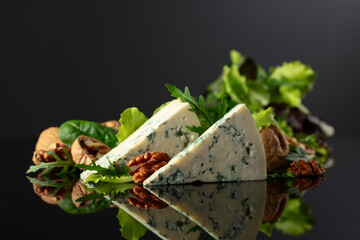 Blue cheese with walnuts and fresh greens.