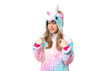 Young girl with unicorn pajamas over isolated chroma key background with surprise facial expression